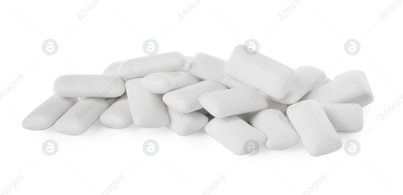 Photo of Pile of tasty chewing gums on white background