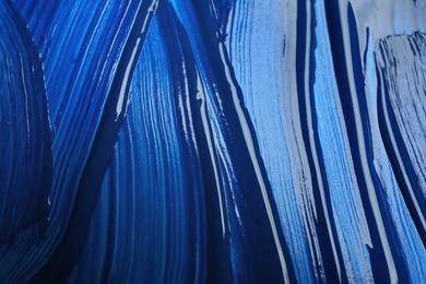 Photo of Paint strokes as background, top view. Color of the year 2020 (Classic blue)