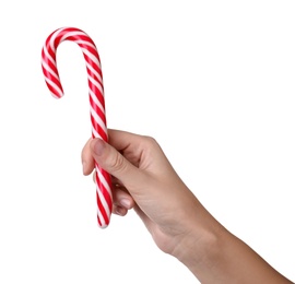 Woman holding sweet Christmas candy cane on white background, closeup