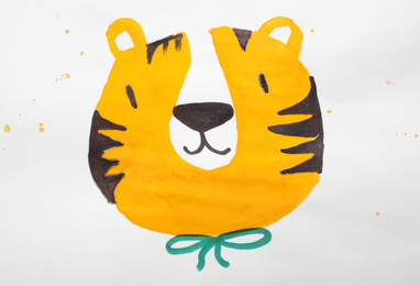 Photo of Child's painting of tiger on white paper
