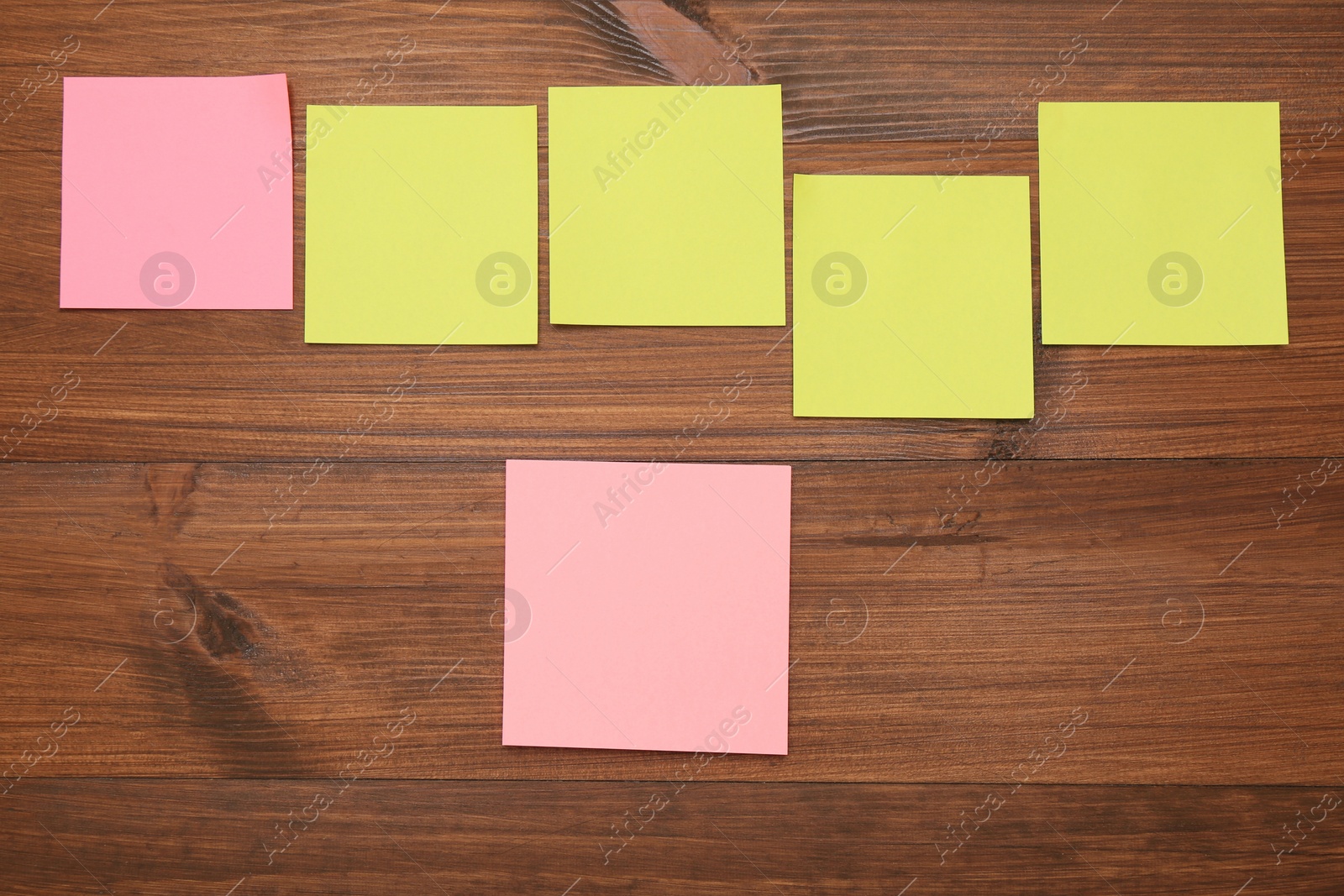 Photo of Colorful stickers on wooden table, flat lay