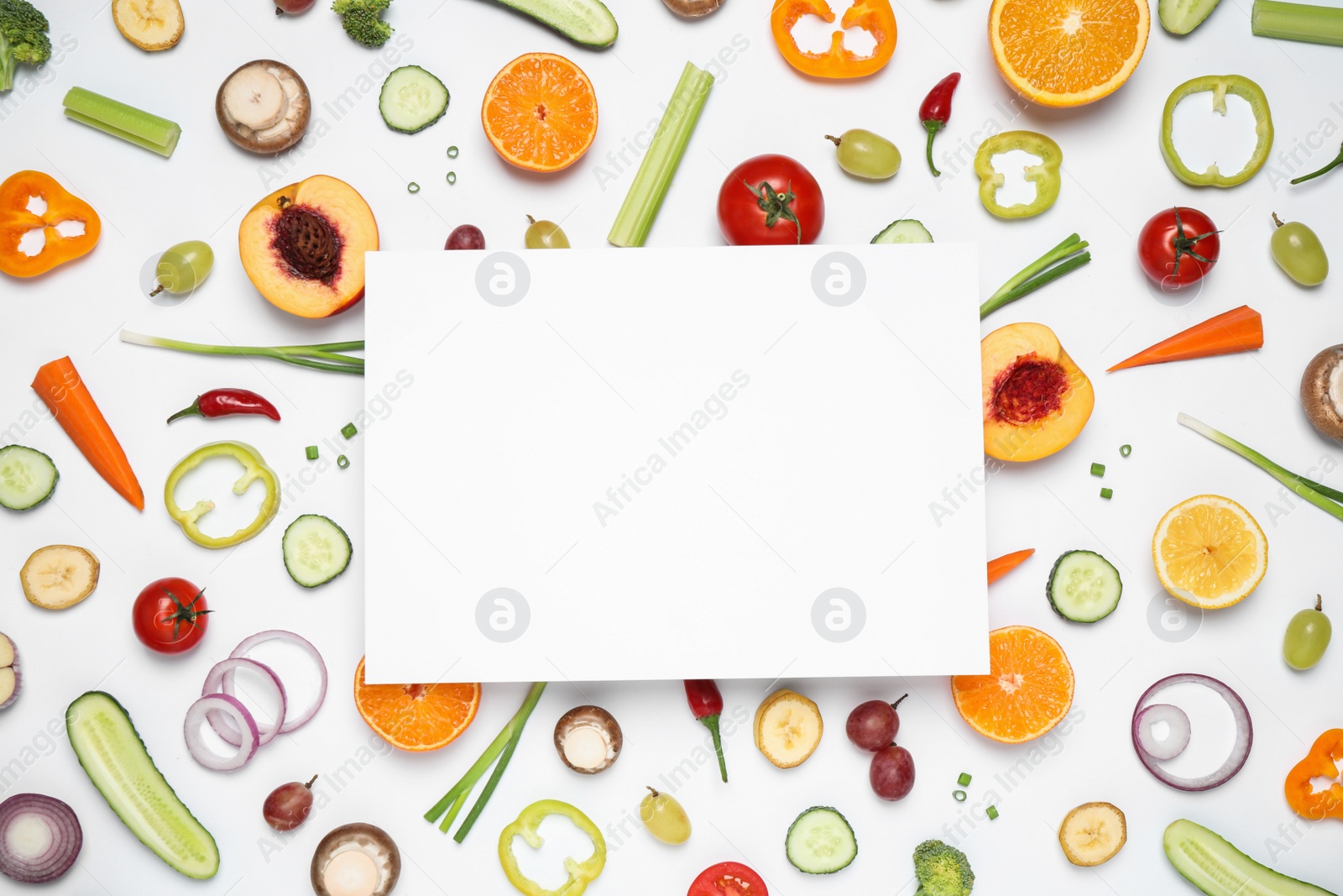 Photo of Fresh organic fruits, vegetables and blank card on white background, flat lay. Space for text