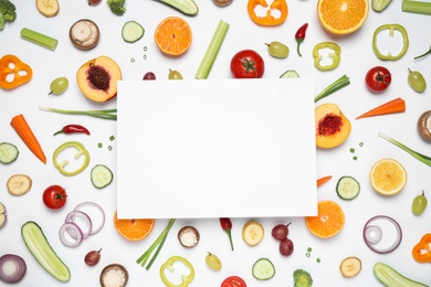 Fresh organic fruits, vegetables and blank card on white background, flat lay. Space for text