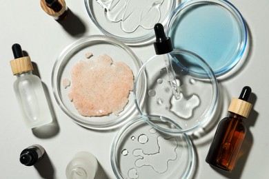 Flat lay composition with Petri dishes on light grey background