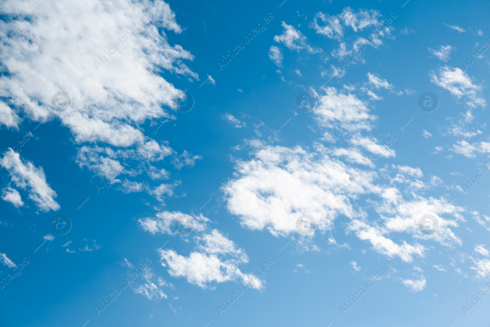 Photo of Beautiful light blue sky with fluffy clouds