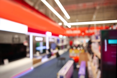 Photo of Blurred view of modern shopping mall interior