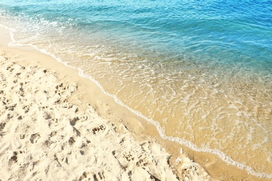 Photo of Sandy beach near sea on sunny day