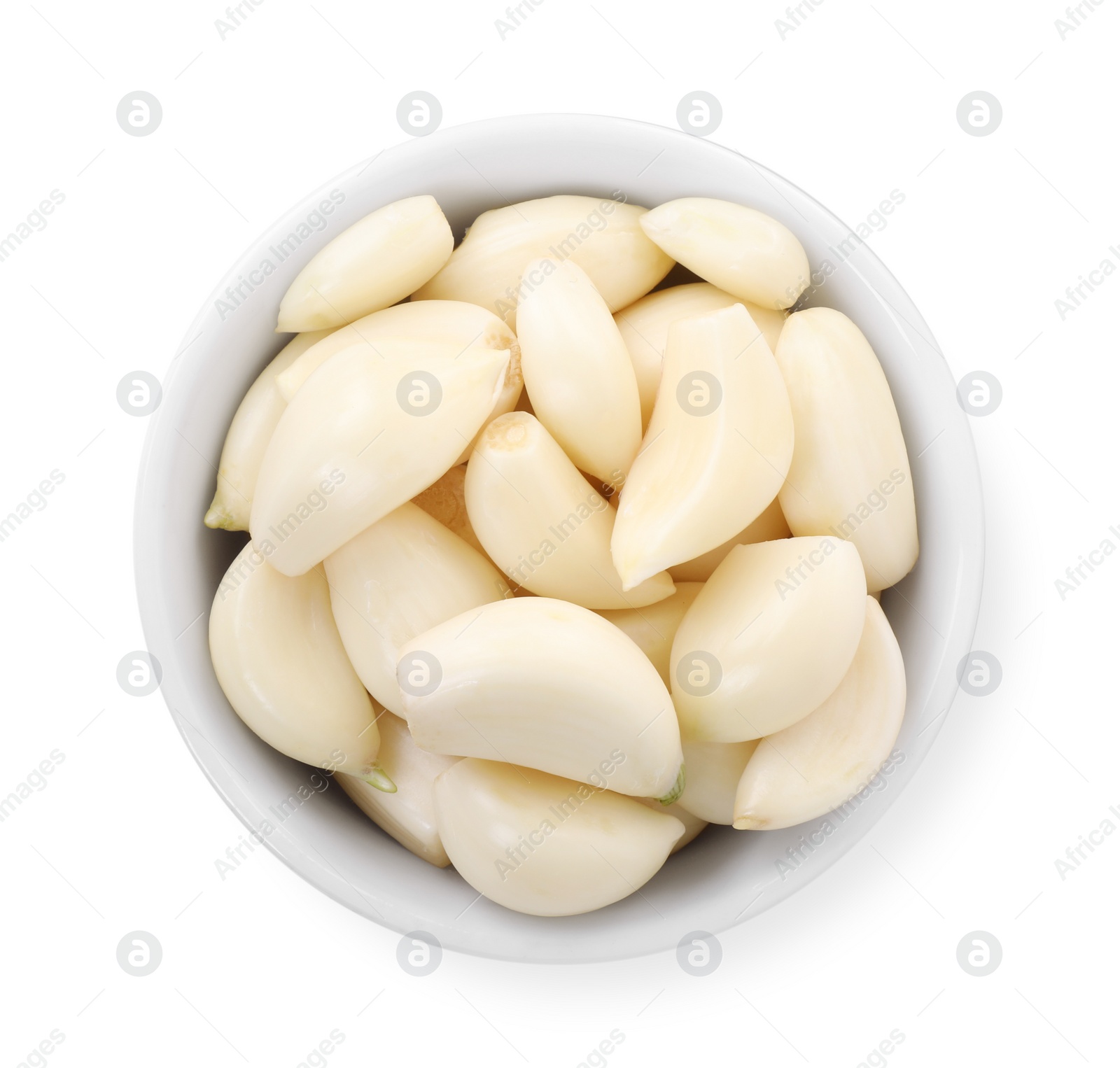 Photo of Peeled cloves of fresh garlic in bowl isolated on white, top view