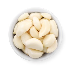 Photo of Peeled cloves of fresh garlic in bowl isolated on white, top view