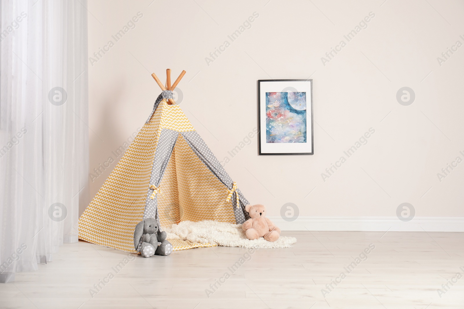 Photo of Cozy child room interior with play tent near window