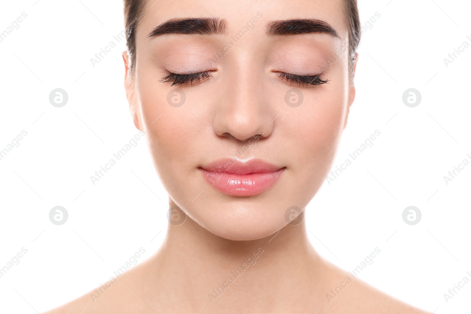 Photo of Portrait of young woman with beautiful face against white background