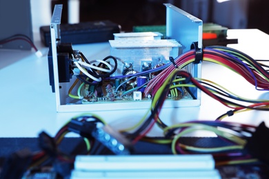 Power supply unit on table. Computer repair service