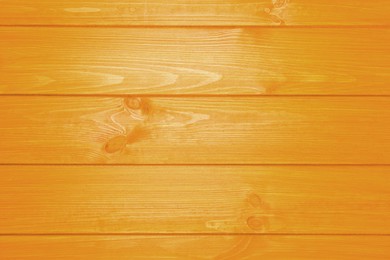 Texture of orange wooden surface, top view
