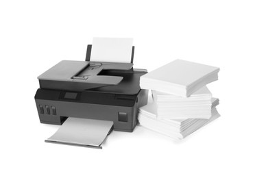 Modern printer and stack of paper on white background