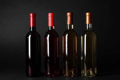 Bottles of expensive wines on dark background