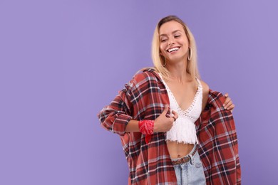 Photo of Portrait of happy hippie woman on purple background. Space for text