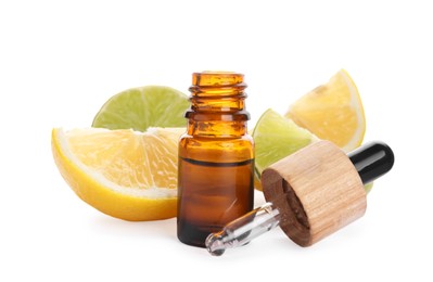 Bottle of citrus essential oil and cut fresh fruits isolated on white