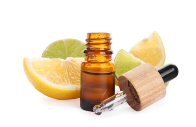 Photo of Bottle of citrus essential oil and cut fresh fruits isolated on white