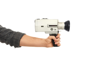 Photo of Man with vintage video camera on white background, closeup of hand