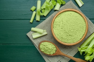 Photo of Natural celery powder and fresh stalks on green wooden table, flat lay. Space for text