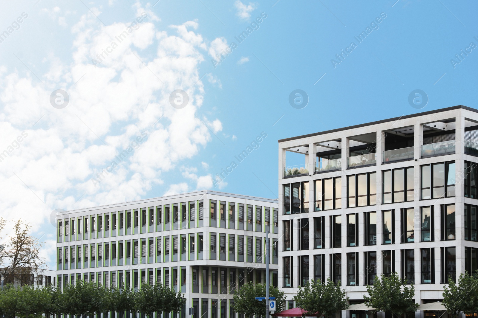 Photo of Beautiful view of modern buildings with big windows outdoors