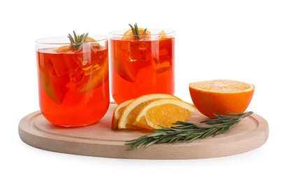 Photo of Aperol spritz cocktail in glasses, orange slices and rosemary isolated on white