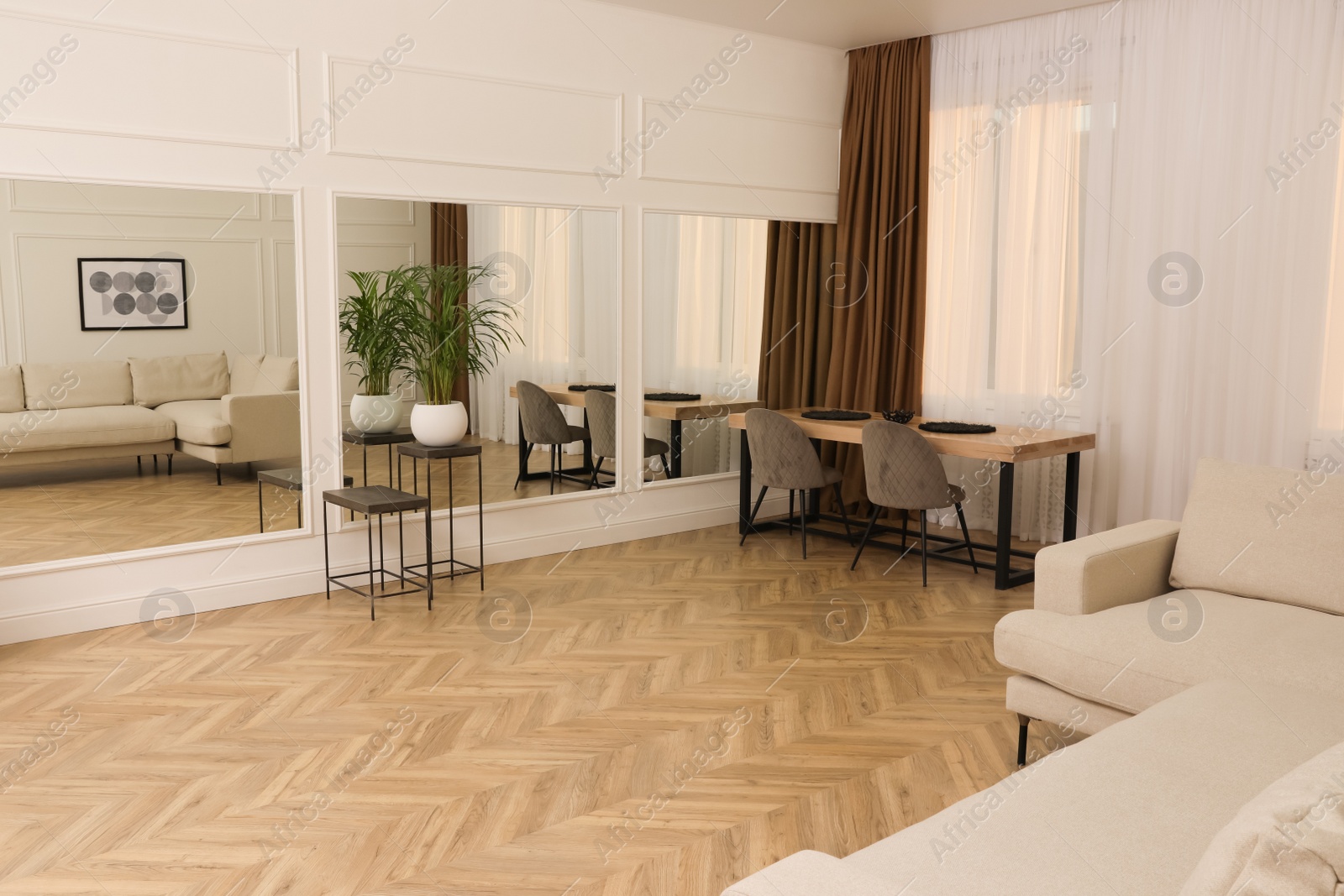 Photo of Modern living room with parquet flooring and stylish furniture