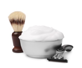 Shaving brush, foam and razor on white background
