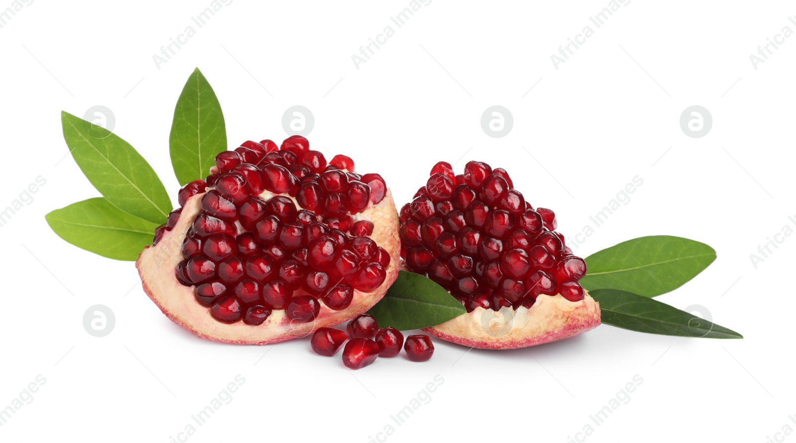 Photo of Pieces of ripe pomegranate with green leaves on white background
