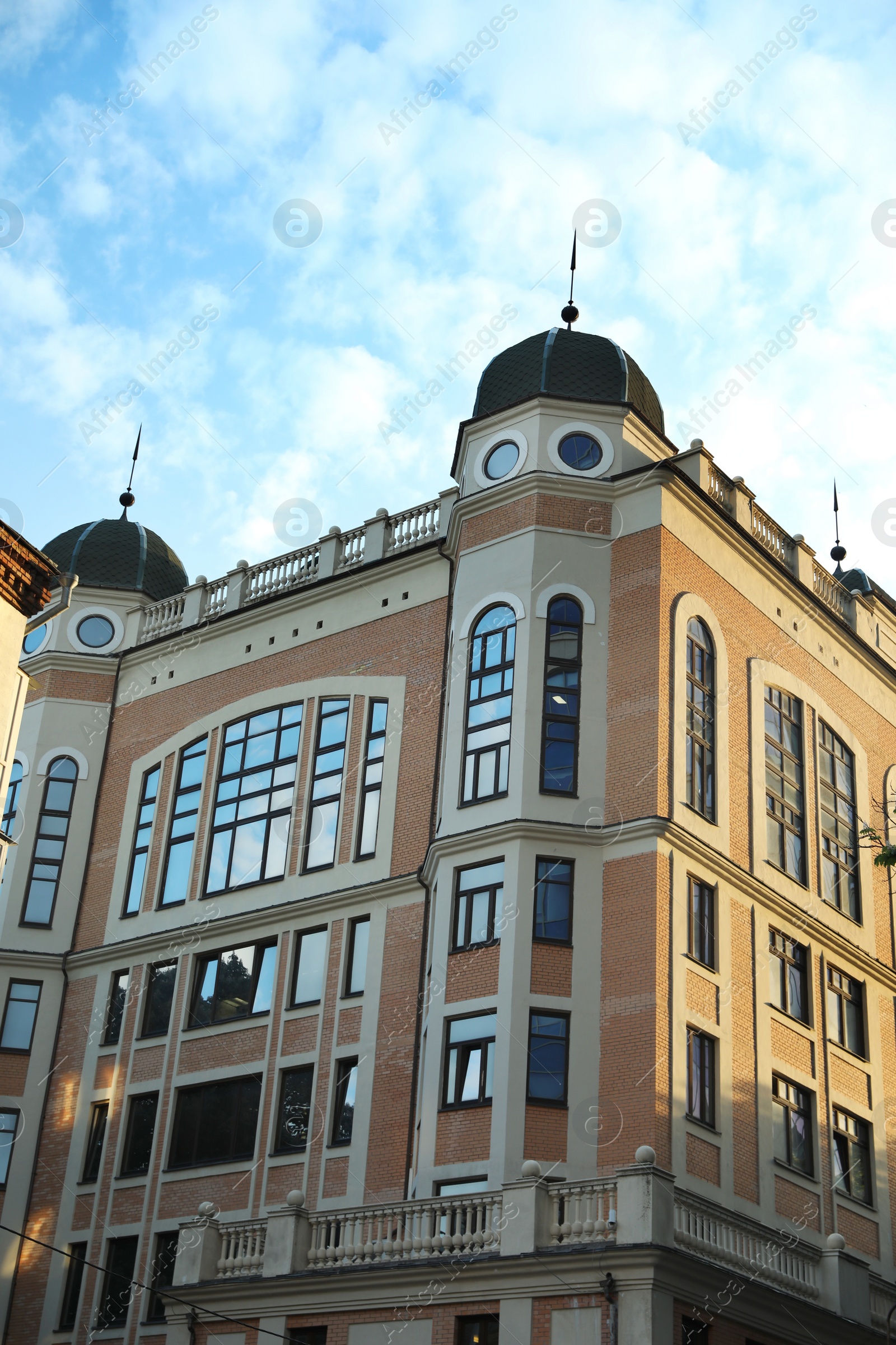 Photo of KYIV, UKRAINE - MAY 23, 2019: Beautiful building against sky with clouds