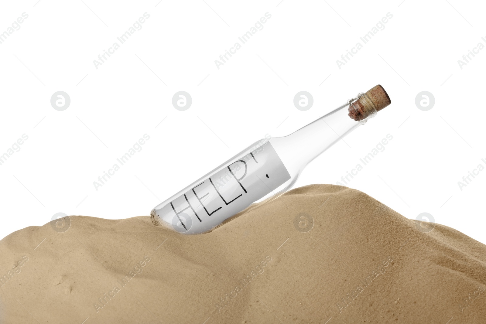 Photo of Corked glass bottle with Help note in sand on white background