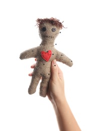 Woman holding voodoo doll with pins on white background, closeup