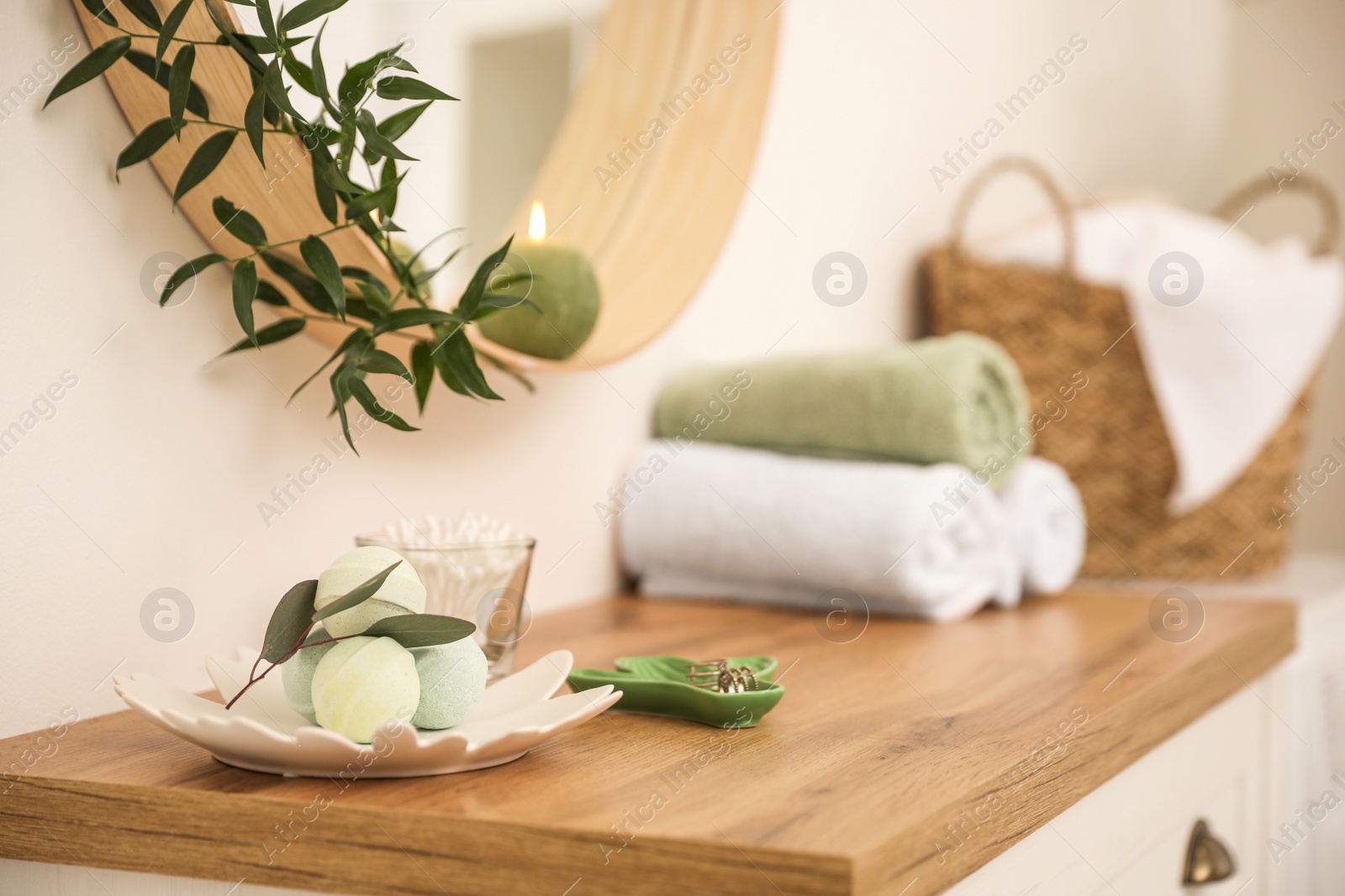 Photo of Bath bombs on wooden table in light room