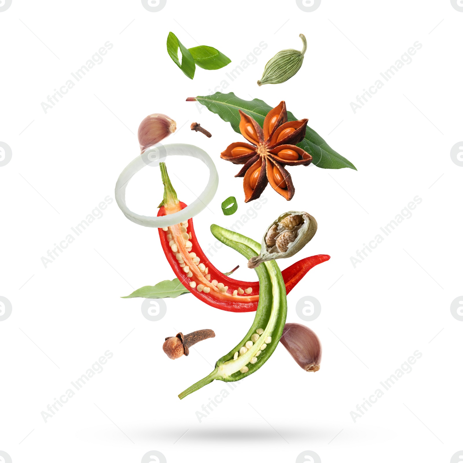 Image of Different aromatic spices falling on white background