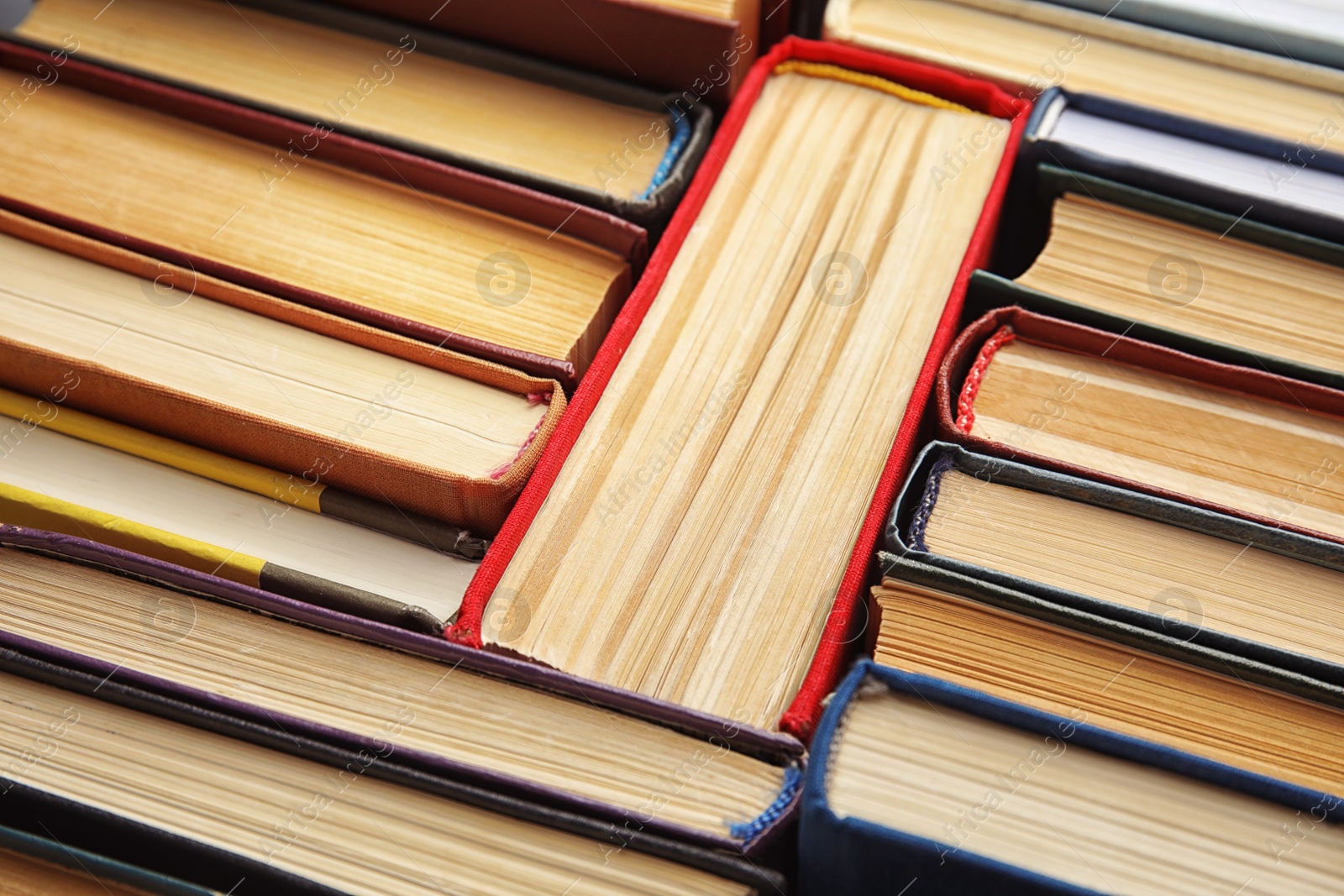 Photo of Many different hardcover books as background, closeup