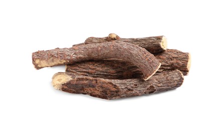 Dried sticks of liquorice root on white background