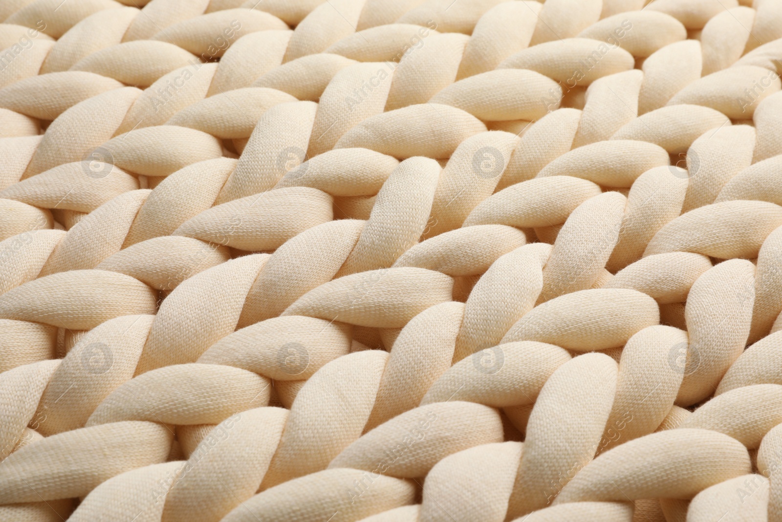 Photo of Chunky knit blankets as background, closeup view