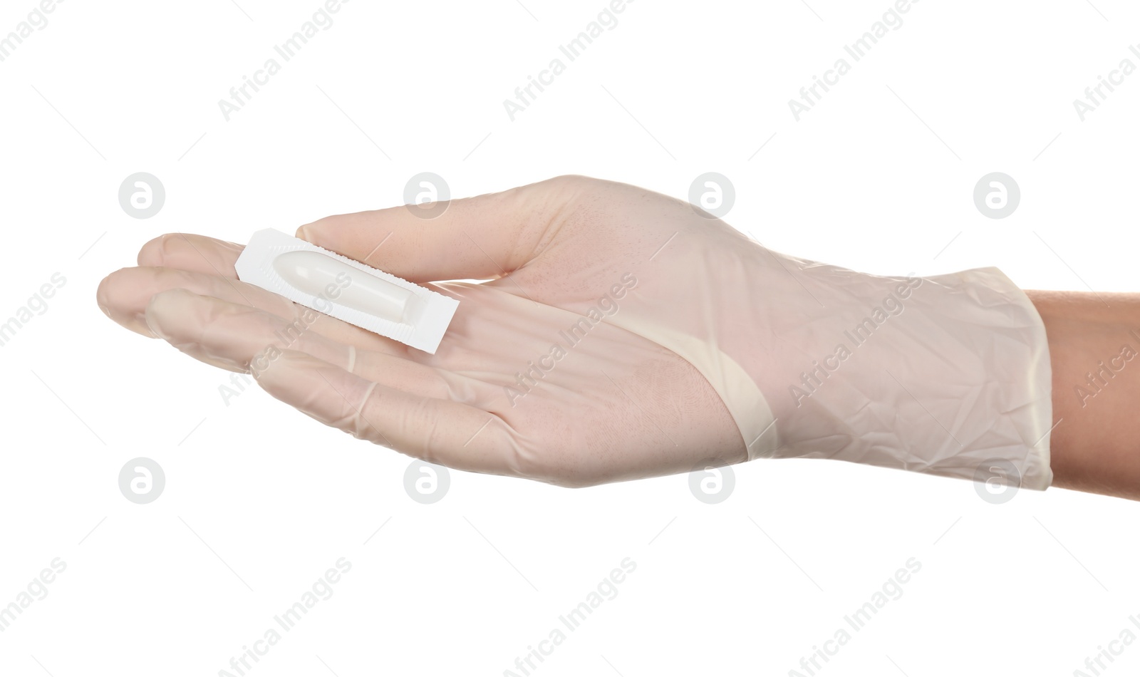 Photo of Doctor holding suppository on white background. Hemorrhoid problems