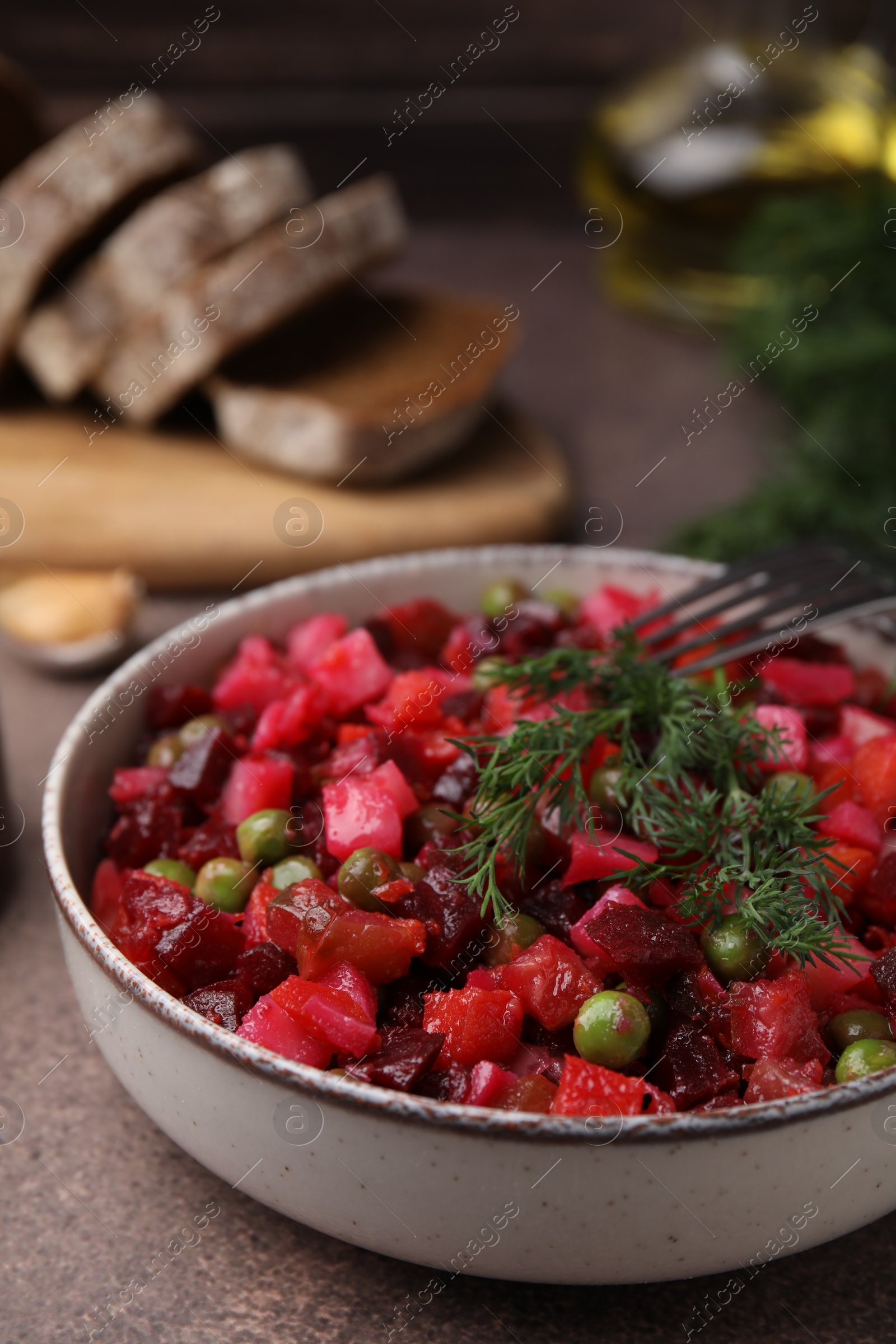 Photo of Delicious vinaigrette salad on grey table, closeup