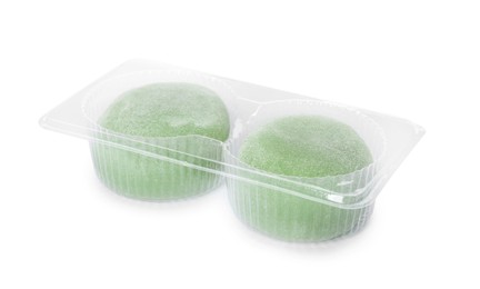 Photo of Delicious mochi in plastic tray on white background. Traditional Japanese dessert