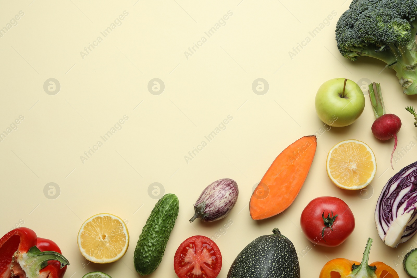 Photo of Flat lay composition with fresh ripe vegetables and fruits on color background. Space for text