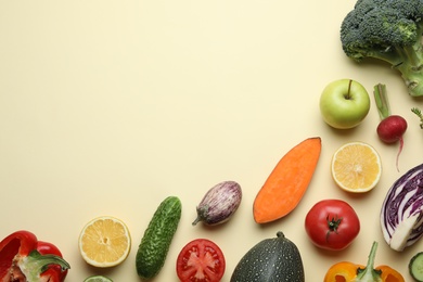 Photo of Flat lay composition with fresh ripe vegetables and fruits on color background. Space for text