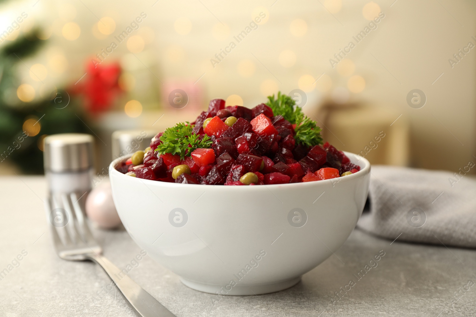 Photo of Traditional Russian salad vinaigrette served on light table