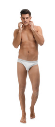 Photo of Handsome man in underwear on white background