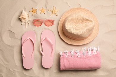 Flat lay composition with beach objects on sand