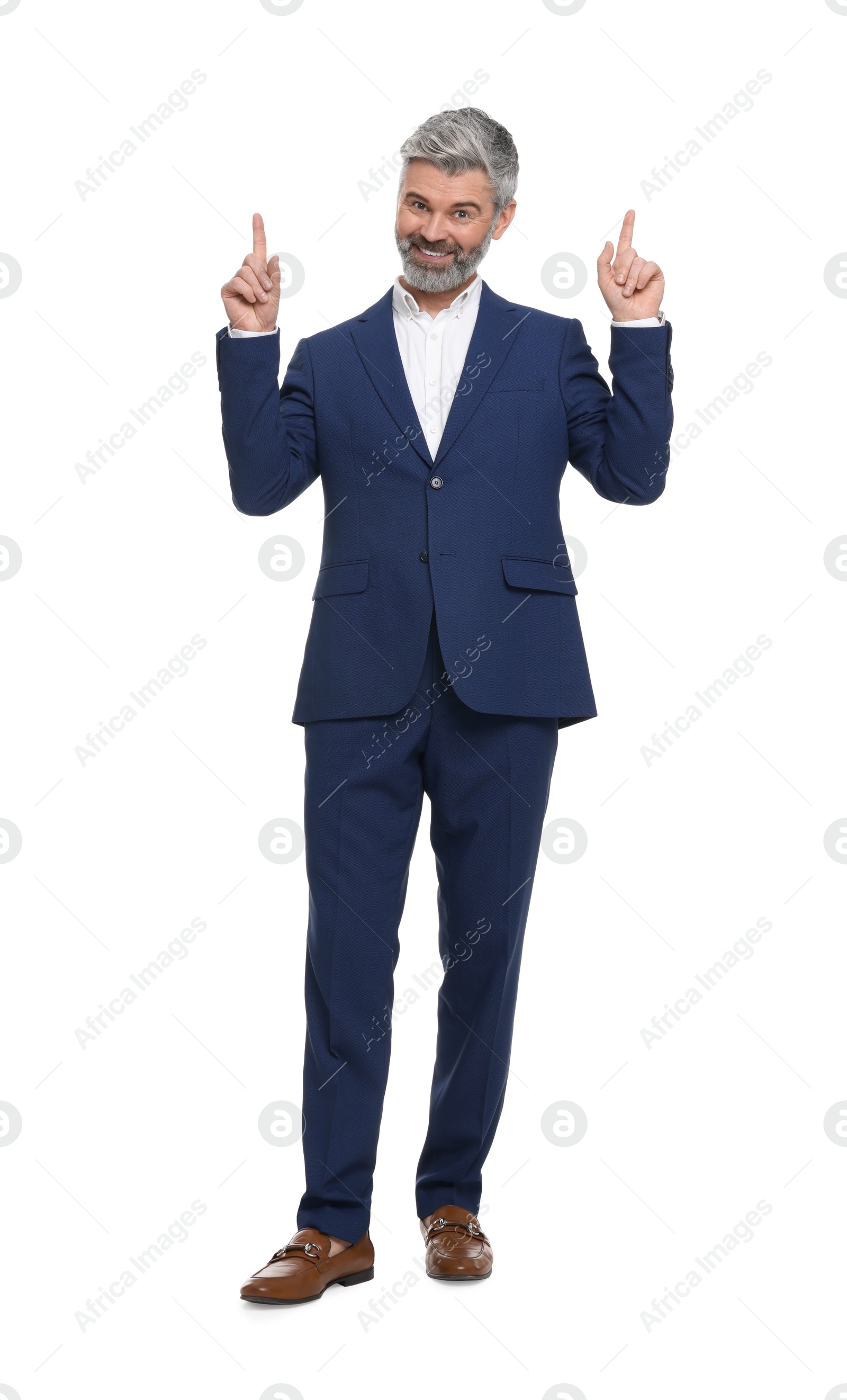 Photo of Mature businessman in stylish clothes posing on white background