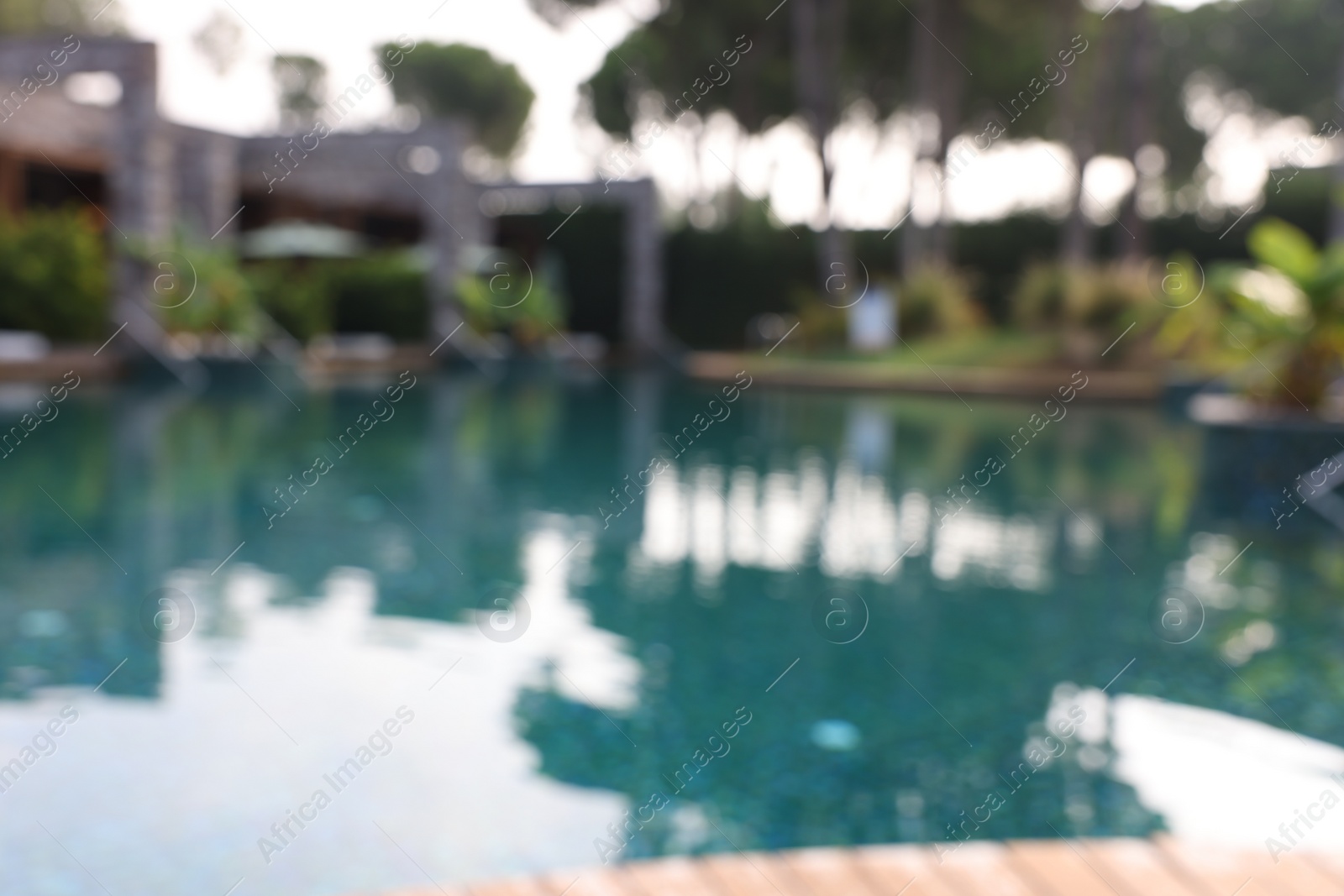 Photo of Blurred view of outdoor swimming pool at luxury resort