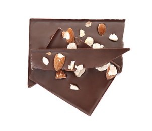 Delicious black chocolate with nuts on white background, top view