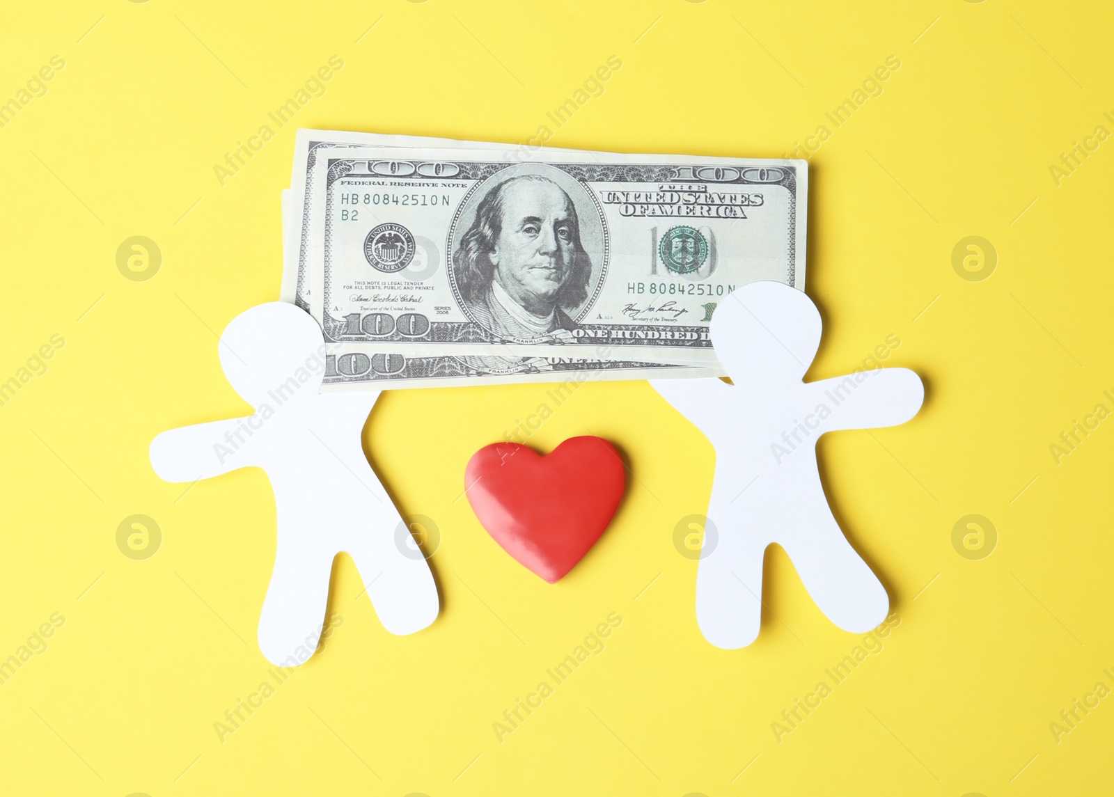 Photo of Paper silhouettes of people with money and heart on color background, top view. Life insurance concept