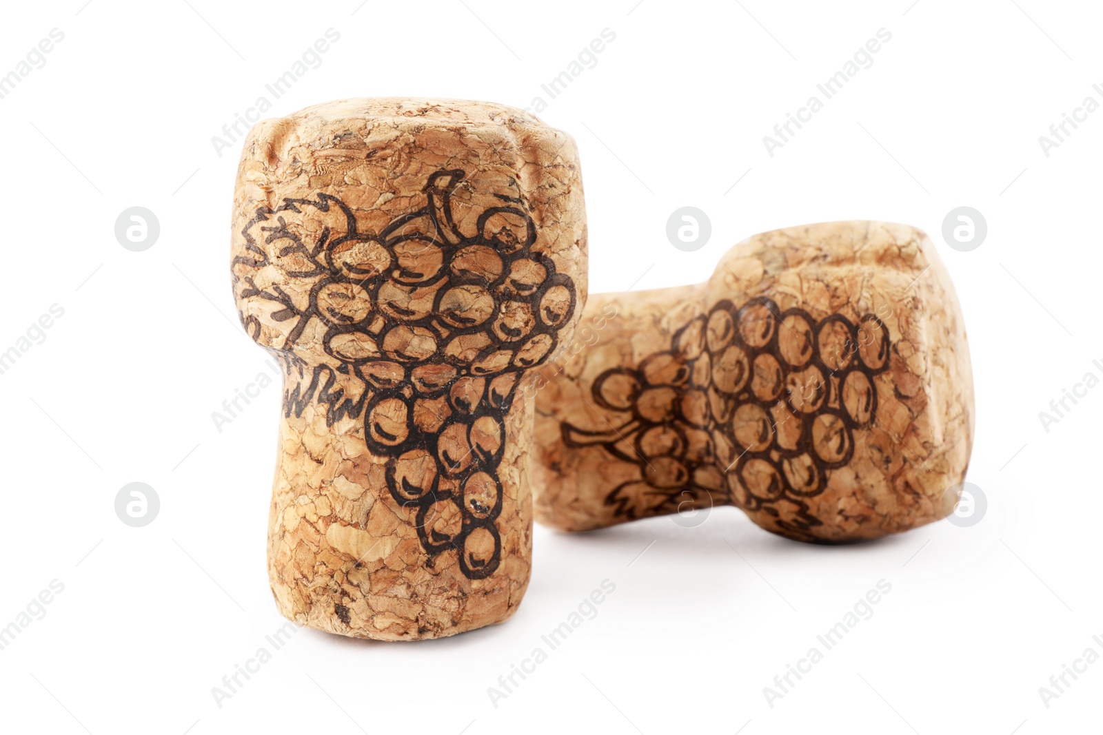 Photo of Two sparkling wine corks with grape images on white background